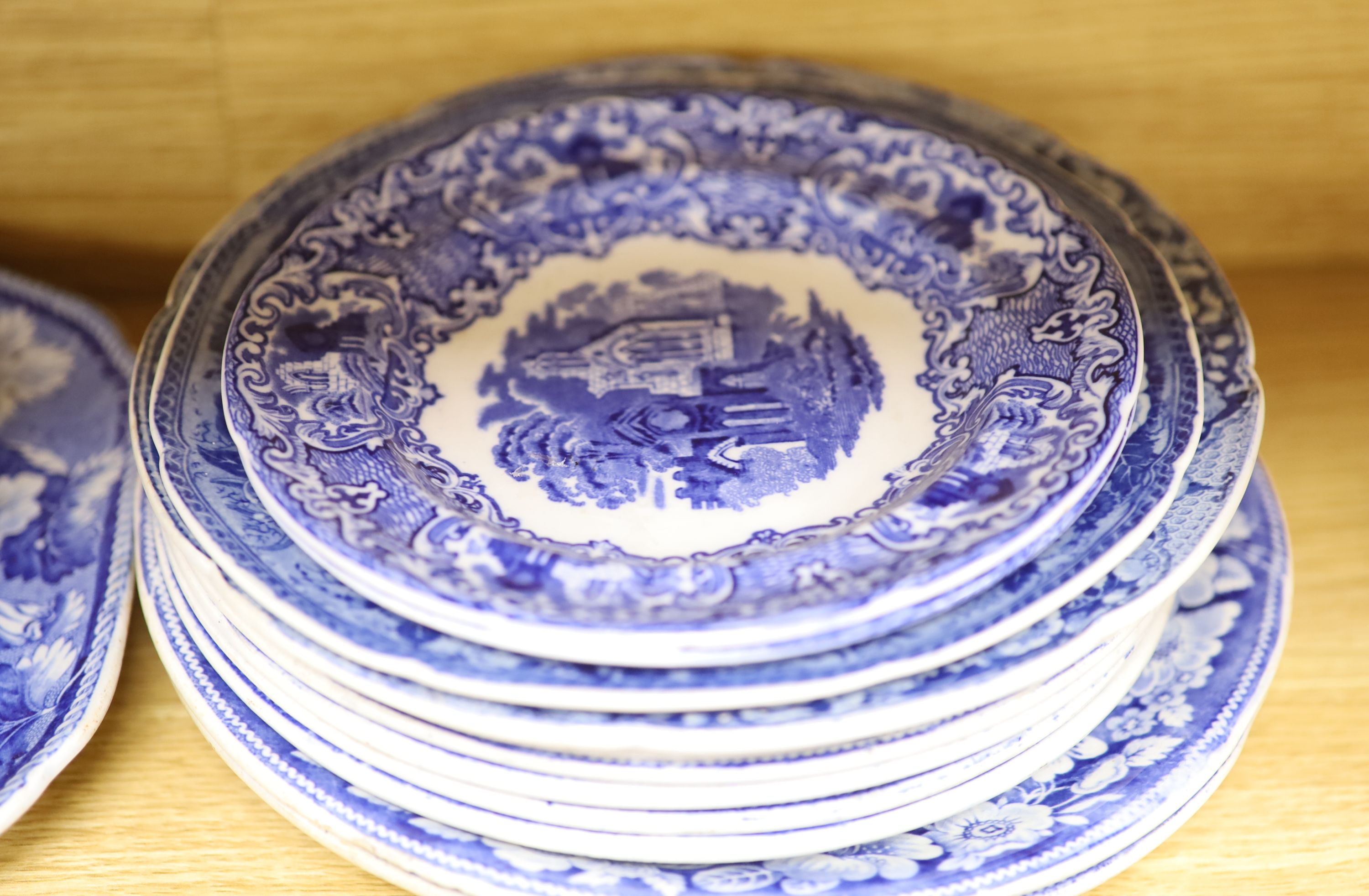 A quantity of 19th century blue and white pottery, including a Harewood House platter, 37cm, and a Spode Rome Tiber soup plate